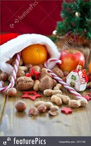 You can also use these stockings to create gifts for your clients and staff. Christmas Stocking Filled With Fruit And Nuts Image