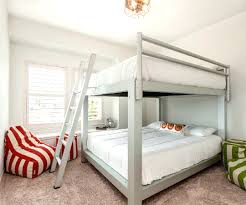bunk beds with queen bed on bottom