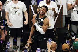 Giannis antetokounmpo of the milwaukee bucks holds the bill russell nba finals mvp award and the larry o'brien championship trophy after defeating the phoenix suns in game six to win the nba. E9yccs2xm8lorm