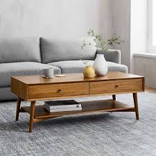 This decorative and versatile large rectangular coffee table is handcrafted using a stunning portuguese carrera marble. Mid Century Storage Coffee Table