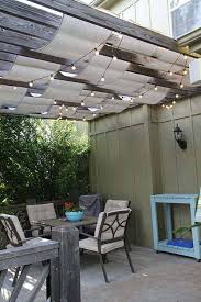 There are eye hooks mounted on the frame of the panels, and the wire cable slides through the hooks, over the top of the panel. 25 Super Easy Sun Shade Ideas For Your Backyard Patio Decor Home Ideas