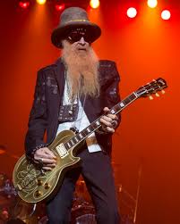 The members of zz top, billy, and frank, would like to share that dusty, their fearless bass player, is on a short detour back to texas, to address a hip issue. Billy Gibbons Wikipedia
