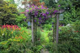 Take four of the 8' 4×4 posts and sink them in the ground one foot. How To Build An Inexpensive Garden Arbor