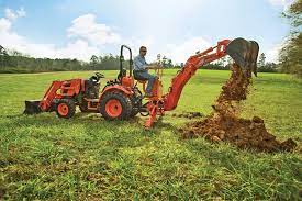 a backhoe implement for a compact tractor