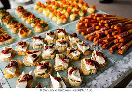 Order delicious cold snacks by phone: Cold Snacks For Guests Cold Snacks With Cheese And Fish And Fruit For A Buffet On The Table For Guests Canstock