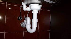 install drain pipes on a kitchen sink