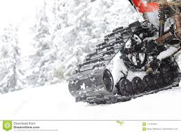 White Snowmobile Track In Snow On Mountain Stock Photo