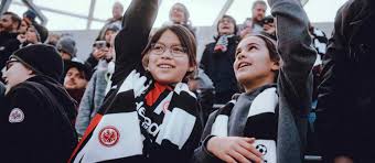 (not comparable, often preceded by a possessive adjective or a possessive form of a noun) younger. Junior Adler Eintracht Frankfurt Fans