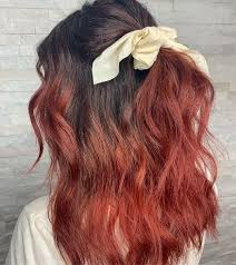 Pink top, ripped jeans, ombre hair. 35 Incredible Black Hairstyles With Red Highlights