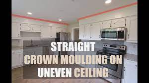 how to install crown moulding on uneven