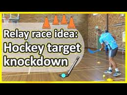 relay race striking hockey target