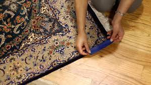 how to keep area rug corners down on