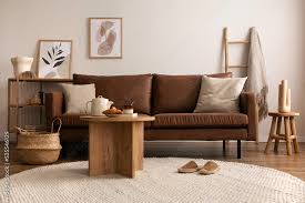 brown sofa round beige carpet wooden
