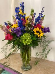 beauty full tall vase of lovely flowers