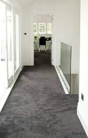 hallway with grey carpet and white