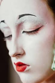 woman in geisha makeup and a