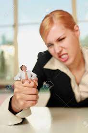 Businesswoman Squeezing A Tiny Businessman Free Image and Photograph  26227050.