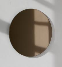 large round bronze tinted orbis mirror