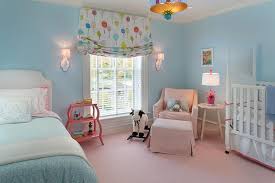 pink and blue nursery with guest bed