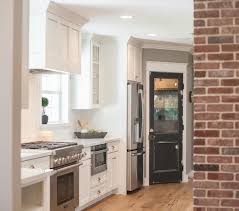 black pantry door cottage kitchen