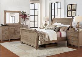 In this airy bedroom, white covers the floors, walls, and ceiling, but a charcoal bed skirt and dark wood furniture help ground the decor. Rooms To Go Queen Size Bedroom Sets Maribointelligentsolutionsco Layjao