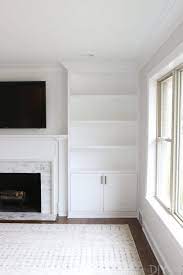 White Built Ins Around The Fireplace