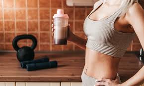 fitness woman is drinking protein shake