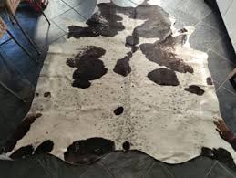 large black 47 white cowhide rug
