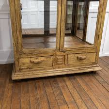 large glazed mirrored display cabinet