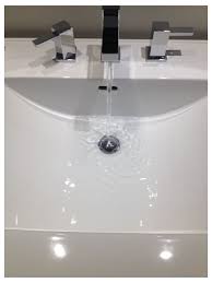 warm water drains slowly from bathroom sink