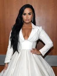See her new look and find out why she made the big change. Demi Lovato Cut Her Long Hair Into An Asymmetrical Lob Photos Allure