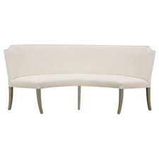 Sweeping lines complement a minimalist shape for a chic look studded with nailhead trim. Nolan Curved Upholstered Bench