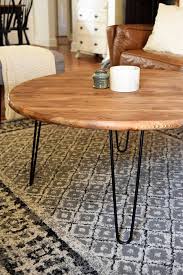 The black metal base has four slim legs with. Round Wood Coffee Table With Black Metal Legs Barkeaterlake Com