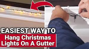 hang christmas lights on gutters