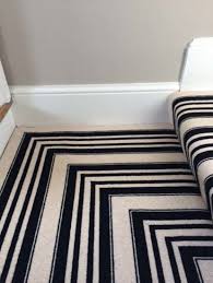 black white stripe carpet to stairs