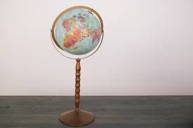 tall stand globe out of the dust als