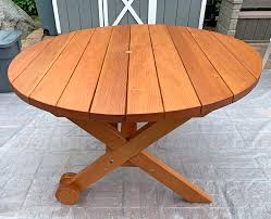 round wood picnic table with wheels