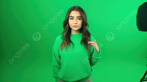 beautiful woman in green sweater posing