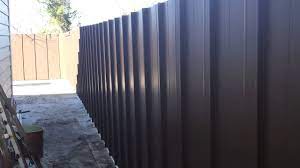 Corrugated metal fencing looks great with both commercial and residential buildings. Building A Metal Fence Youtube