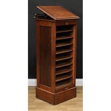 an oak tambour front filing cabinet in