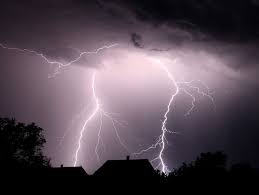 lightning strikes a metal roof