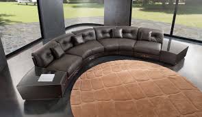 semi circular sofa sitting in bla
