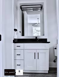 It has a royal look. Transitional Bathroom Cabinets White Shaker Cabinets With Matte Black Accessories And White Shaker Cabinets White Bathroom Cabinets Transitional Style Kitchen