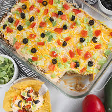 layered taco dip with meat devour dinner