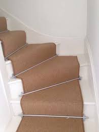 installing brown carpet to stairs as a