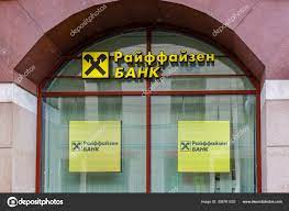 Moscow, Russia - September 13, 2019: Arched window with signboards of Raiffeisen Bank in Moscow downtown. Raiffeisen Bank sign in russian – Stock Editorial Photo © BoneKot #308761532