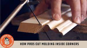 How Pros Cut Molding Inside Corners - YouTube