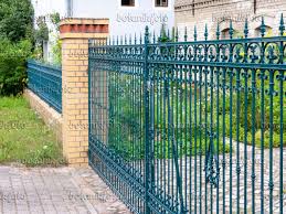 image blue cast iron garden fence with