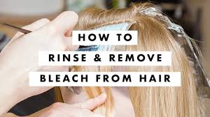rinse and remove bleach from the hair