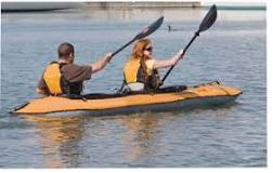 Where should heavier person sit-in kayak?